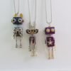 O1CN01LNJImR1WIse91sxzn_2215393582766-0-cib.jpg Close-up of handcrafted wooden robot necklace details